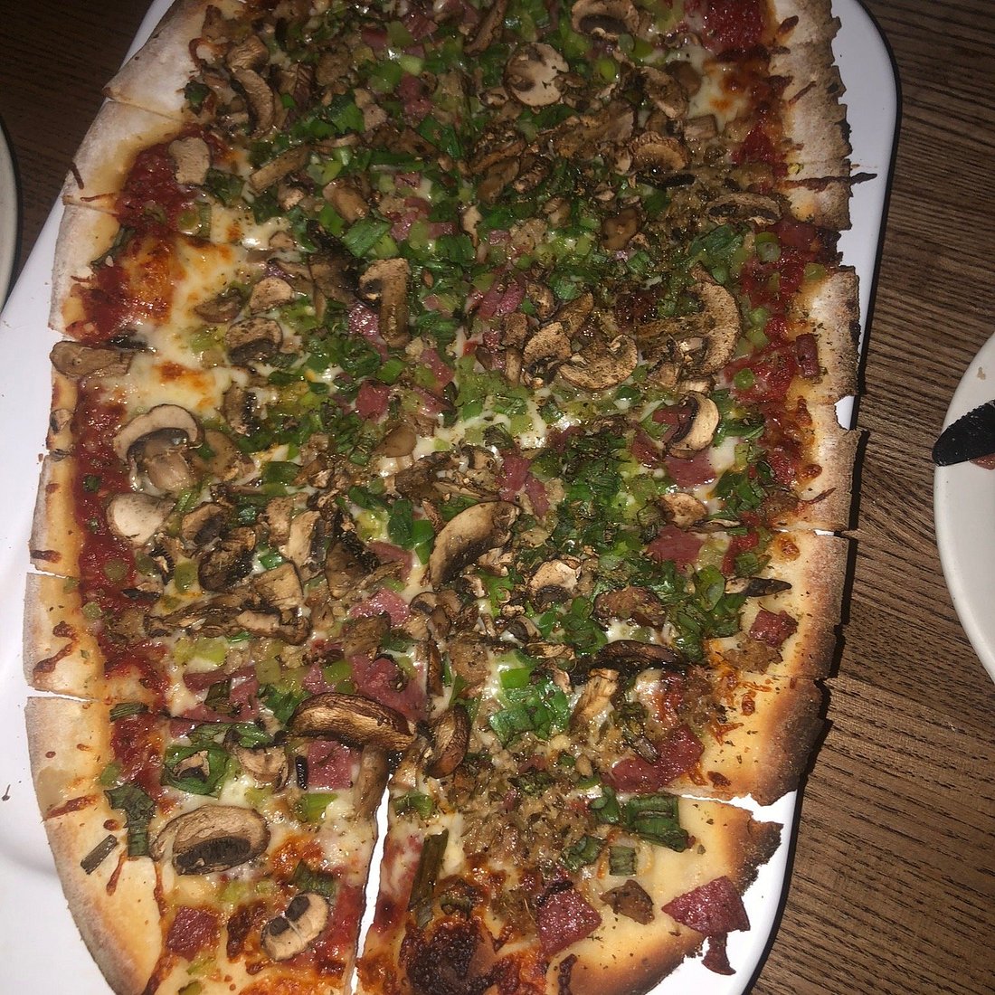 Campisi’s Egyptian Restaurant signature dishes The All The Way PizzaCrab ClawsLasagna